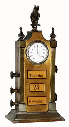 Mixed lot: C.1900, Swedish, Manual desk calendar in brass with cast owl on top, now with a key wind Swiss watch movement in place of the original time movement. — Antique Clocks Price Guide