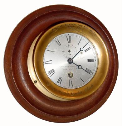 C.1911 (dated), Chelsea timepiece, won by the "Gilt Edge" in cat boat races in July 1911, 4.5 inch dial, mounted on a turned walnut base for wall hanging. — Antique Clocks Price Guide