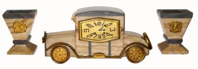 C.1925, French Marble and Bronze, Automobile and Clock, 3-piece Deco set, bronze pieces signed F. Rasumny, dial signed J. Coste, Aix en. Provence, 8-day bell strike, pendulum movement. — Antique Clocks Price Guide