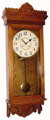 C.1905, Waterbury Clock Co., POSTAL wall regulator in oak, 8-day, time and strike, spring movement. — Antique Clocks Price Guide