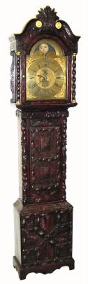 C.1820, English, D. Seddon, Frodsham, 8-day brass dial tall case with rolling moon in arch, ringed winding holes, seconds dial below 12, and calendar aperture above 6, in a carved oak case with broken arch hood. — Antique Clocks Price Guide