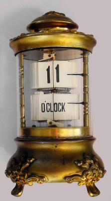 C.1907, Plato Clock Co (div Ansonia), No. 7234, digital novelty clock, with embossed floral case. — Antique Clocks Price Guide