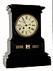 C.1890, German, Multi Dial calendar clock, the lower dial with apertures for the day, month and date. The day and month are on paper rollers and the date is on a cloth ribbon that rolls from a large spool to a smaller one. 