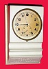 C.1950, Swiss, Battery Desk clock, 3v, in original white plastic counter top display with wooden base.
