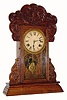 C.1906, Waterbury Clock Co., "Henshaw", 8-day time/strike oak gingerbread clock. 