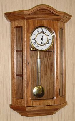 C.2000, Black Forest Clock Co, Cleveland, OH, Hermle movement, Westminster chime wall clock with display shelves, oak case. — Antique Clocks Price Guide