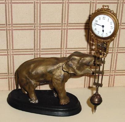 C.2001, Classical Clock Co., California, Reproduction swinging arm clock, THE ELEPHANT. — Antique Clocks Price Guide