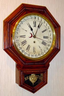 C.1915, Waterbury Clock Co., Short Drop Calendar, school timepiece, pressed oak case with 8-day movement. — Antique Clocks Price Guide