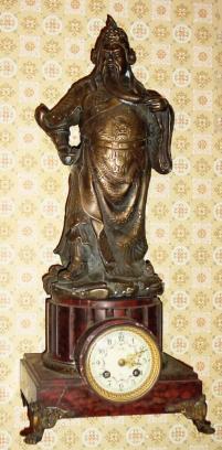 C.1890, Le Roy, French, 8-day time/strike red marble mantel clock with a modern oriental figure. — Antique Clocks Price Guide