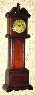 C.1925, Lux Clock Mfg, Waterbury, Conn, mini tall case made of solid wood segments, glued together. — Antique Clocks Price Guide