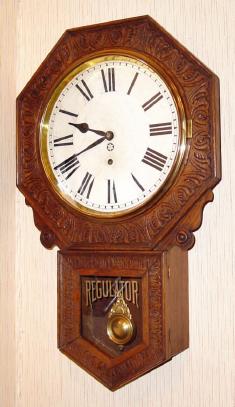 C.1911, New Haven Clock Co., BRANFORD, highly embossed short drop octagon in oak. — Antique Clocks Price Guide