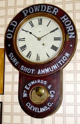 C.1895, Seth Thomas Advertising clock for "Old Powder Horn - Sure Shot Ammunition" at Wm Edwards and Co, Cleveland O. — Antique Clocks Price Guide