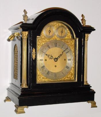 C.1890, English, 3-Fusee, 8-Bell Quarter chime bracket clock, in the style of a century earlier, an ebonized case with gilt columns and flame finials. — Antique Clocks Price Guide