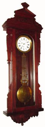 C.1883, New Haven Clock Co., Regulator No. 9, with original pinwheel movement and grid pendulum in walnut. To quote the New Haven catalog for that year "Finished with Glass Sides, Movement of best Swiss Pattern, Sweep Second Hand, Dead Beat Escapement, 12 Inch Porcelain Dial, Steel and Brass Pendulum Rods, adjusting to heat and cold." — Antique Clocks Price Guide