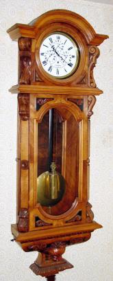 C.1887, Vienna 1-Weight, F. Mark, 30-Day multi-dial timepiece, showing time on 4 dials, local, London, New York and Petersburg, in a walnut case with canted corners and a lion's head on the base. — Antique Clocks Price Guide