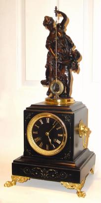 C.1885, French, Guilmet, Mystery clock, a patinated spelter statue holding the pendulum which swings with no apparent impulse. — Antique Clocks Price Guide