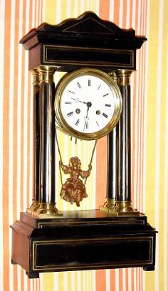 C.1890, French, Swinging Girl Portico clock, 8-day time and bell strike (cast girl in dress swings front to back). — Antique Clocks Price Guide