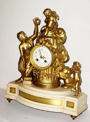 C.1890, French, Marble and Spelter figural mantel clock, titled Le Triomphe de Pamour. — Antique Clocks Price Guide