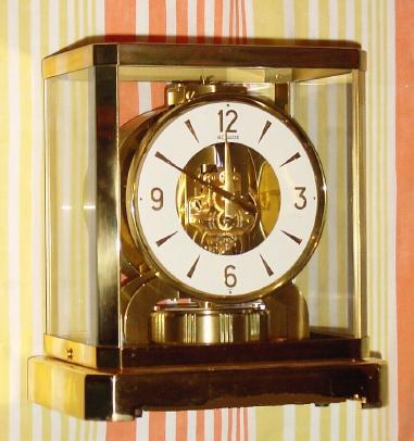 C.1965, Swiss, Le Coultre, Atmos, Never wind clock, running on changes in temperature and pressure, with original sales receipt dated 1965, from Sprang Jewelry in Los Angeles. — Antique Clocks Price Guide