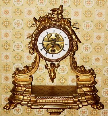 C.1890, French, Swinging Doll Timepiece, in a gilt white metal case with ormolu 'doll pendulum". — Antique Clocks Price Guide