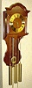 C.2000, German, Hermle, Westminster Wall clock, 3-weight, chain drive, in a walnut case with a shaped splat behind the pendulum.