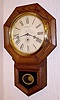 C.1920, Wm. L. Gilbert, 12 Inch Drop Octagon, in oak, 8-day time only.