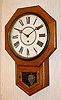 C.1910, Waterbury, Short Drop Octagon school clock, 11 inch dial, time only.