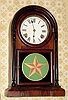 C.1878, E. N. Welch Mfg Co., Rosewood Shelf clock, with turned side columns, an Italian model with replaced door from another model (previous door latch is evidence).