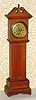 C.1920, Kronheimer Co., New York, mini tall case with "heartbeat" dial.