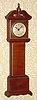 C.1920, German, "Florn" brand, 30 hour mini tall case made of solid wood segments, glued together.