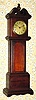 C.1925, Lux Clock Mfg, Waterbury, Conn, mini tall case made of solid wood segments, glued together.