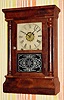 C.1870, New Haven Clock Co., 8-day time/strike/alarm column and cornice shelf clock.