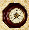 C.1875, Mixed lot, a Waterbury octagonal sectioned case, now with a New Haven time and alarm movement, mounted up on a spacer board within the case.