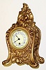 C.1895, Boston Clock Co., Rip Van Winkle, 8-day tandem wind mantel clock with fancy porcelain dial with raised Arabic numerals, white circles on an ivory background.