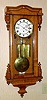 C.1865, Austrian, 3-Wt Dwarf, Grand Sonnerie, oak case, with full size 7" dial and short drop pendulum.