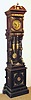 C.1890, German, LFS Uhrenfabrik, OPEN WELL HALL CLOCK, with around 32 pieces of bronze trim accenting the ebonized oak case, and with sunburst pendulum and fancy weights.