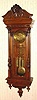 C.1885, Austrian, 3/4 Column, 3-Weight, Grand Sonnerie wall clock, walnut case with engraved weights, dial center and matching grid-iron pendulum.