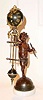 C.1890, French, Miniature Swing Clock, a small statue of cupid on a star studded globe, holding a bow in his left hand and the clock support in his right hand.
