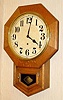 C.1920, New Haven Clock Co., 12 Inch Drop, in oak, 8-day time only.