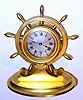 C.1920, French, for Scottish retailer, desk timepiece in the shape of a ship's wheel, jeweled lever timepiece, rear wind, with shutter for f/s adjust.