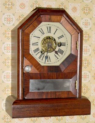 C.1868, Seth Thomas, Thomaston, COTTAGE D, 1-Day, time and alarm mini cottage clock, octagon top, in rosewood. — Antique Clocks Price Guide