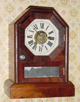 C.1870, Seth Thomas, Thomaston, COTTAGE D, 1-Day, time and alarm mini cottage clock, in mahogany. — Antique Clocks Price Guide