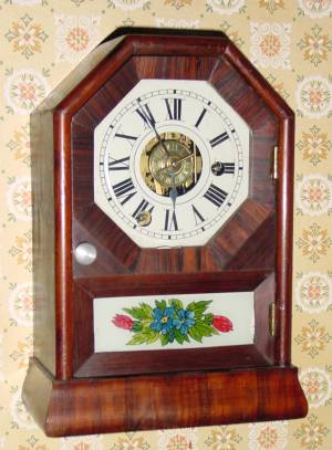 C.1855, Seth Thomas, Plymouth Hollow, COTTAGE C, 1-Day, time and alarm mini cottage clock, rosewood octagon top with grained sides. — Antique Clocks Price Guide