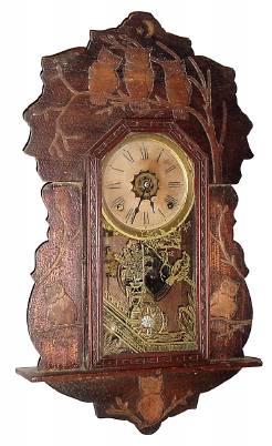C.1910, Wm. L. Gilbert, Progress No. 56, Hanging gingerbread with pressed "Owl" pattern. — Antique Clocks Price Guide