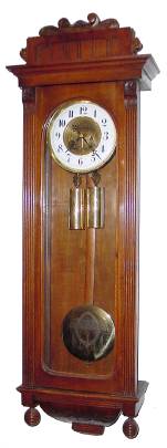C.1900, German, 2-Wt Vienna Regulator in a walnut case in very late Victorian style, with reeded pilaster case style. — Antique Clocks Price Guide