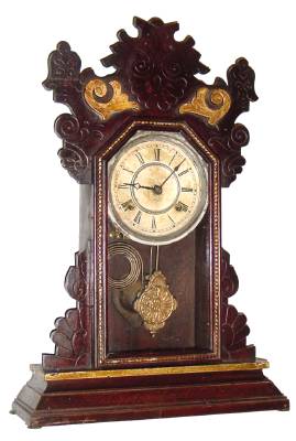 C.1890, Waterbury Clock Co., 8-day time/strike walnut gingerbread clock, as-found — Antique Clocks Price Guide