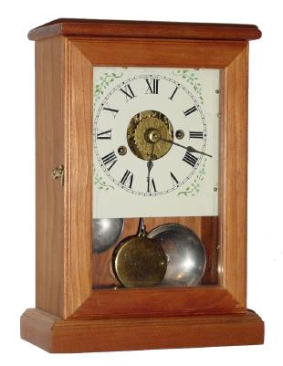 A quality Repro Cherry Case, with a 19th century 1-day time and alarm movement. — Antique Clocks Price Guide