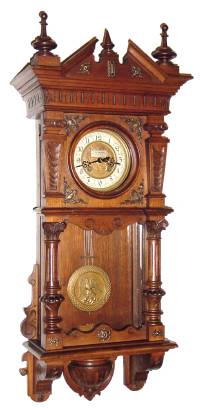 C.1900, German, Gustav Becker, 8-day time and strike wall clock, double door style with brass trim. — Antique Clocks Price Guide