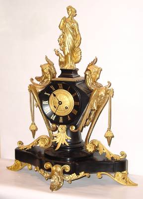 C.1890, French, A. Carlhian, 8 Beaumetz, Paris, Fantasy figural clock case, ormolu and black marble, 8-day time and bell strike. — Antique Clocks Price Guide