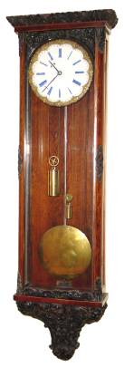 C.1830, Austrian, Biedermeier, Huygens Continuous loop wind, eight day timepiece in a slender case with profuse molded trim. — Antique Clocks Price Guide